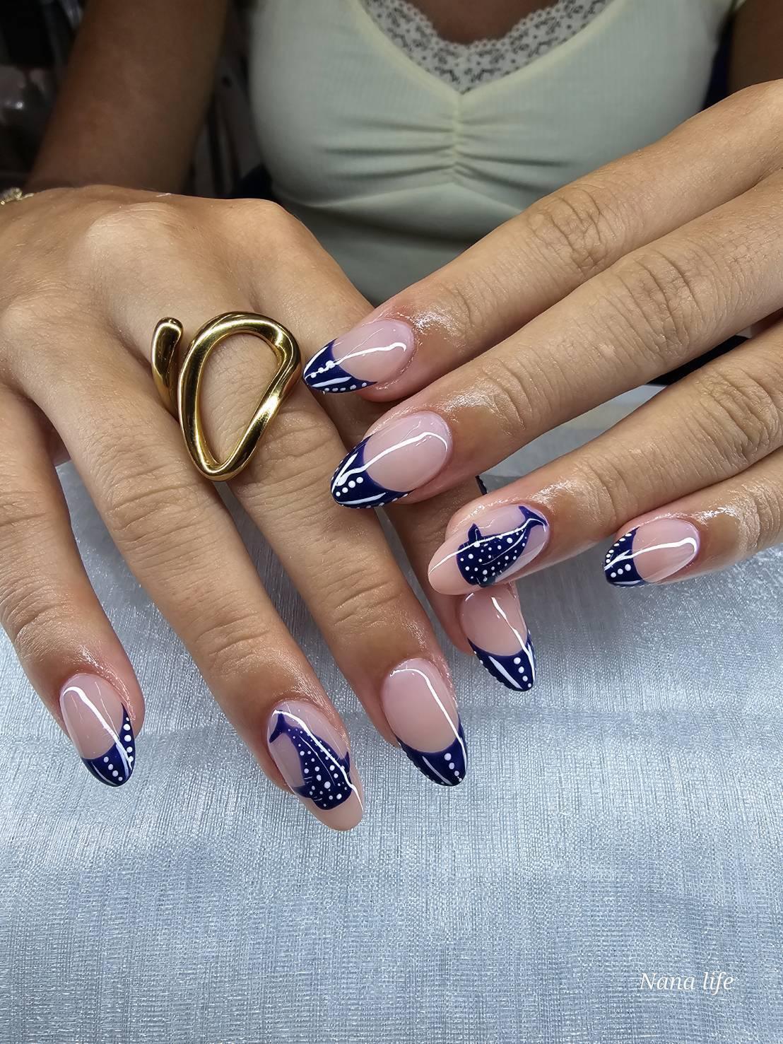 Close-up of navy blue gel nail art with a white line detail, done at Colorr Nails, Koh Phangan