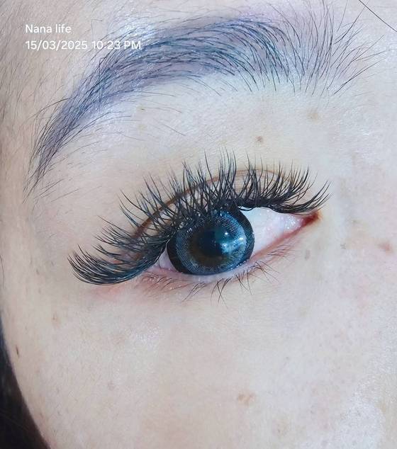 Close-up of full, natural-looking eyelash extensions
